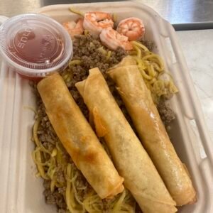 Stir fry noodles "Pancit" with chicken lumpia